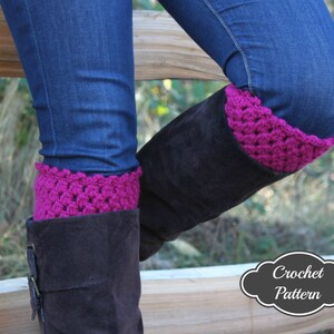 May include: A pair of brown suede boots with a bright pink crocheted cuff. The boots are worn by a person wearing blue jeans. The image includes the text "Crochet Pattern".