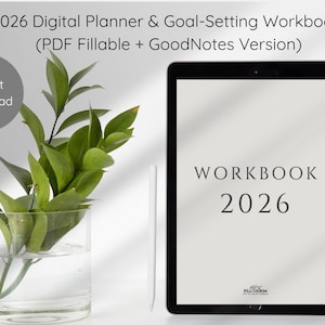 Op de afbeelding: Een digitale planner en een werkboek voor het stellen van doelen voor 2026 worden weergegeven op een zwarte tablet. De tekst "WORKBOOK 2026" is zichtbaar. Een glazen vaas met groene bladeren en een witte stylus staan ook in de afbeelding. De woorden "Direct downloaden" staan in een grijze cirkel.