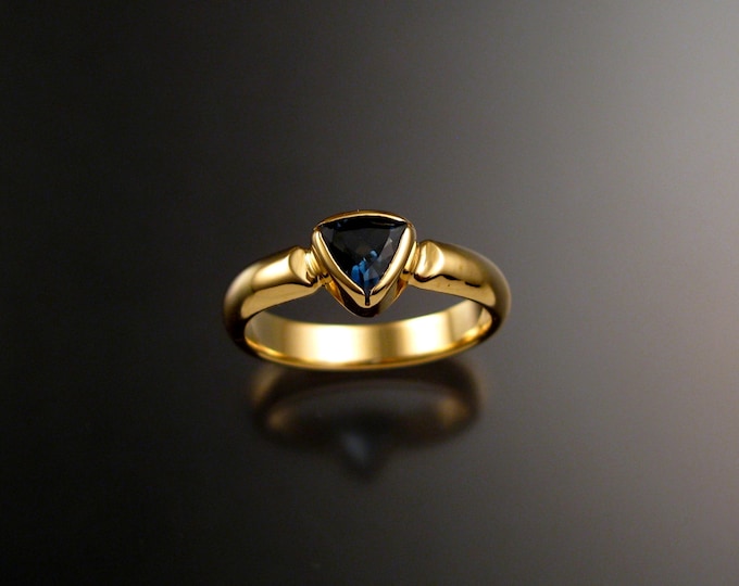 London Blue Topaz Triangle ring set in 14k Yellow Gold