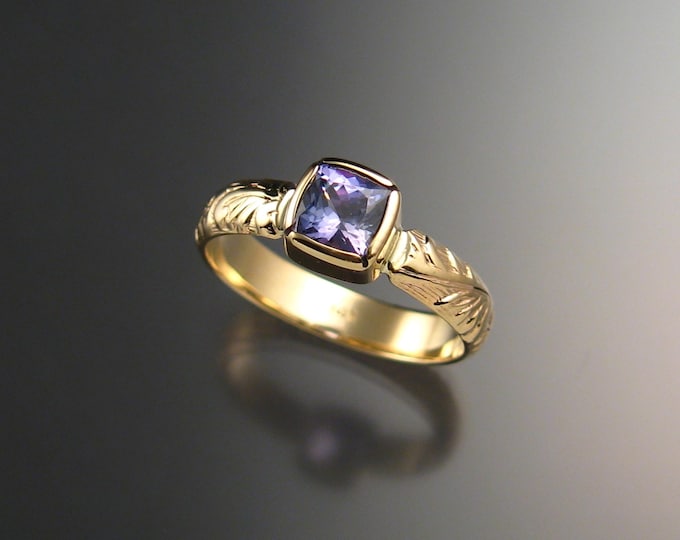 Natural Tanzanite ring with 14k gold victorian floral pattern band and cushion cut bezel set stone made to order in your size.