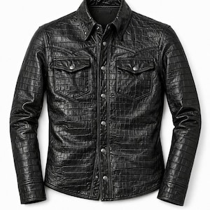 May include: A black leather shirt with a crocodile skin texture. The shirt has a button-down front, two chest pockets with button closures, and long sleeves. The collar is a classic point collar.