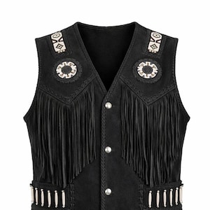 May include: Black suede vest with fringe detailing and decorative beadwork. The vest features a V-neck, silver buttons, and fringe along the front and bottom. The shoulders have decorative beadwork and the vest is a classic western style.