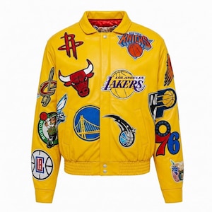 May include: A bright yellow varsity jacket featuring a variety of colourful embroidered NBA team logos and basketball-themed patches across the front and sleeves. The jacket has a classic collar, snap button closure, and ribbed hem and cuffs.