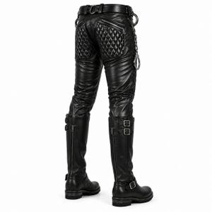 May include: Black pants featuring quilted panels on the back and sides, a belt with metal hardware, and a silver-toned chain accessory. The pants are paired with black knee-high boots that have vertical zippers, double buckle straps, and block heels.