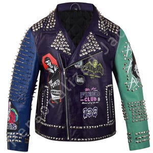 May include: A purple leather jacket with blue and green leather sleeves. The jacket is covered in silver studs and has several patches sewn on the front. The patches feature band logos and graphics, including "Misfits", "Fiend Club", and "138".