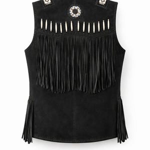 May include: Black suede vest with fringe and decorative beading. The vest features long fringe along the bottom and a row of fringe across the chest. The shoulders and back are adorned with white and silver beads. A unique piece for a bohemian look.