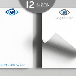 May include: White notepads with a blue eye logo and the text "Emily Carter, OD". The image shows two notepads, one with a curled corner, and a gray circle with the text "12 Sizes".