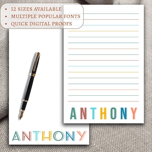 May include: Personalized stationery with the name "ANTHONY" in colorful block letters. The stationery has lined paper with colorful lines and a black fountain pen.