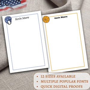 May include: Two white notepads with sports-themed illustrations. One features a blue hockey helmet, the other a basketball. Each notepad has the name "Kevin Moore" at the top. Text at the bottom reads "12 sizes available", "multiple popular fonts", and "quick digital proofs".