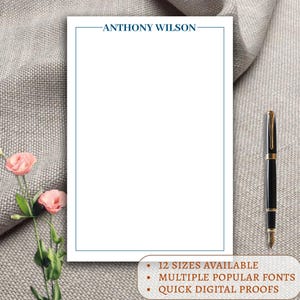 May include: A white stationery template with a blue border and the text "ANTHONY WILSON" at the top. The template has text at the bottom that says "12 SIZES AVAILABLE", "MULTIPLE POPULAR FONTS", and "QUICK DIGITAL PROOFS".