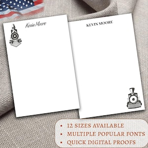 May include: Two white stationery note cards with a black train engine graphic. The top card has the text "Kevin Moore" in black cursive font. The bottom card has the text "KEVIN MOORE" in black sans-serif font. The text below the cards reads "12 SIZES AVAILABLE", "MULTIPLE POPULAR FONTS", and "QUICK DIGITAL PROOFS".
