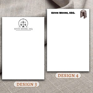 May include: Two designs for letterhead stationery. The first design features a scale of justice with the text "Kevin Moore, Esq." The second design features a gavel with the text "Kevin Moore, Esq."