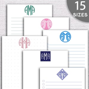 May include: A set of five printable stationery sheets with different monogram designs. Each sheet features the letters "AMA" in a different color and style, including a circle, square, diamond, and dotted pattern.