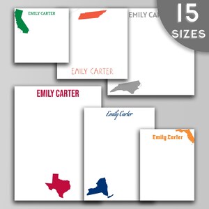 May include: Set of personalized stationery featuring various state outlines in different colors. The name "Emily Carter" is printed on each sheet.