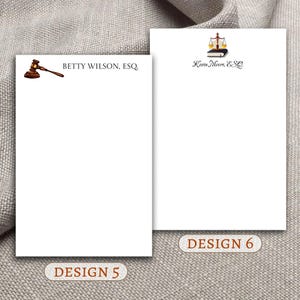 May include: Two different designs for legal stationery. The first design features a gavel and the text "BETTY WILSON, ESQ". The second design features a scale of justice and the text "Kevin Moore, ESQ".