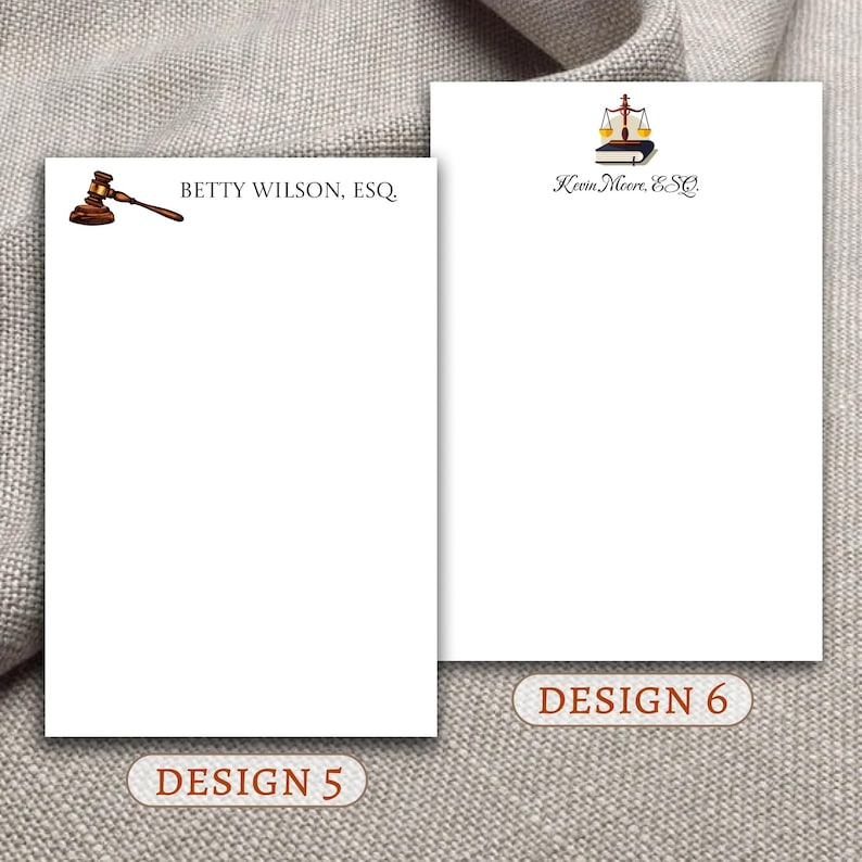 May include: Two different designs for legal stationery. The first design features a gavel and the text "BETTY WILSON, ESQ". The second design features a scale of justice and the text "Kevin Moore, ESQ".