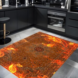 May include: A large, intricately patterned rug with a fiery orange and yellow design. The rug has a traditional Persian style with a central medallion and floral motifs. The rug is laid out on a gray tiled floor in a modern kitchen.