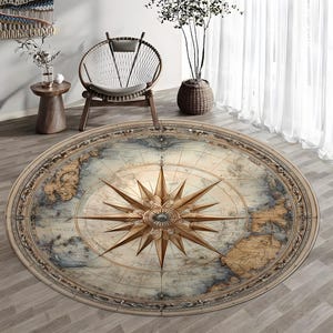 May include: A circular rug with a detailed vintage map design. The rug features a compass rose at its centre, surrounded by a world map in beige, blue, and brown tones. The rug is placed on a wooden floor.