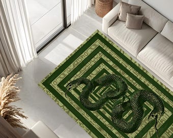 May include: Green and beige rug with a black and green snake design. The snake is curled up in the center of the rug, and the design is repeated in a pattern of squares.