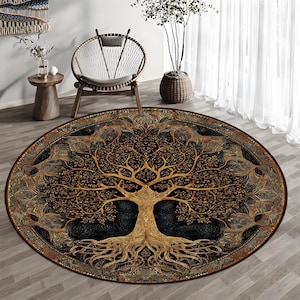 May include: An oval rug featuring a detailed tree of life design in shades of gold and brown against a black background. The rug has an ornate border and is placed on a wooden floor, enhancing the room's decor.