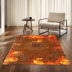 May include: A fiery orange and yellow rug with a traditional Persian design. The rug has a central medallion and intricate floral patterns.