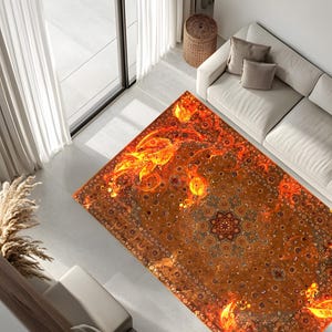 May include: A large, rectangular rug with a detailed, intricate design in shades of orange, yellow, and brown. The rug features a central medallion with floral motifs and a swirling pattern.