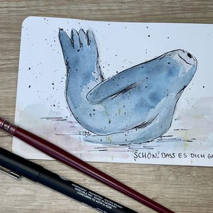 Handgemalte Aquarell Postkarte – Robbe mit Spruch „Schön, dass es dich gibt“ – Grußkarte Geburtstag, Geburt, Kinderkarte