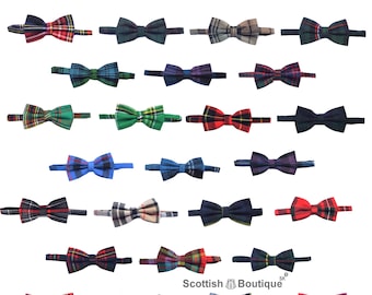 May include: A collection of bow ties in various tartan patterns. The bow ties are in a variety of colors, including red, green, blue, and black. The text "Available in 50+ Tartans Tie" is at the top.
