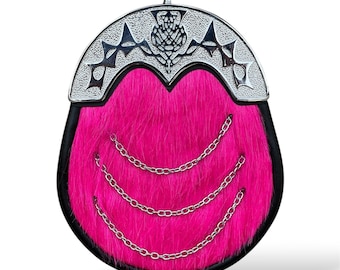 May include: A pink faux fur sporran with a silver thistle and chain detail.
