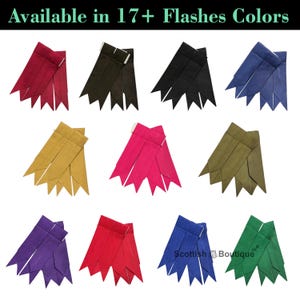 Op de afbeelding: Een set van 10 verschillende gekleurde kiltflashes, elk met vijf afzonderlijke delen. De kleuren zijn rood, zwart, blauw, goud, roze, groen, paars en twee tinten rood. De tekst "Scottish Boutique" is zichtbaar in de rechterbenedenhoek van de afbeelding.