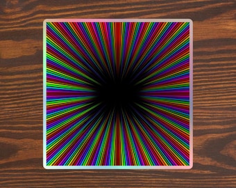 May include: A square sticker with a black background and a colorful radial pattern of lines radiating outward from the center. The lines are in shades of red, orange, yellow, green, blue, indigo, and violet.