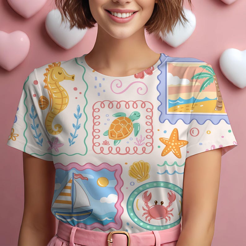 May include: A short-sleeved t-shirt featuring a repeating pattern of postage stamp-style illustrations. The design includes a yellow seahorse, a green sea turtle, a sailboat, a pink crab, a starfish, a seashell, and a tropical beach scene.