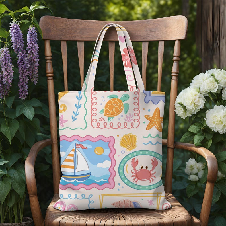 May include: A cream-colored tote bag featuring a repeating pattern of colorful illustrations including a sea turtle, a sailboat, a crab, a starfish, and various seashells framed in scalloped borders with soft pink, blue, and yellow accents.