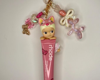 Shiba Hipper Bag Charm: Authentic Cherry Blossom Hipper Sonny Angel on Rhode Lip Balm