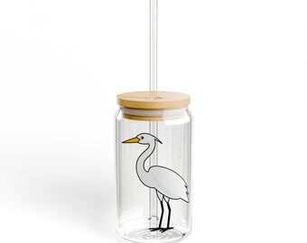 May include: A clear glass drinking jar with a white egret illustration, a bamboo lid, and a clear drinking straw.