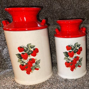 One of A Kind. Complete Set of 4 Retro Strawberry Milk Can Lids Canister set. Flawless. See all pictures for more details.They are Mint !