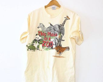 Vintage 80s “This Place Is a Zoo” T-Shirt, Tan Safari Animal Harlequin Graphic Tee, Size Large