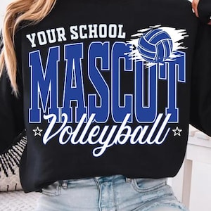 May include: A black long-sleeve sweatshirt featuring a graphic print in blue and white. The text reads YOUR SCHOOL MASCUT Volleyball, accompanied by a blue and white volleyball illustration and two small stars on the front of the garment.