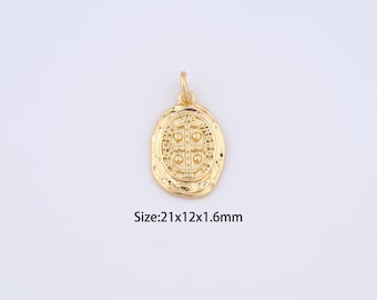 May include: Gold-toned pendant charm with a detailed cross design. The pendant is oval-shaped and measures 21 x 12 x 1.6 mm.