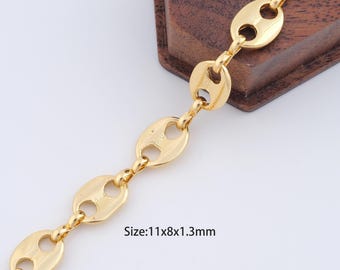 May include: Gold chain bracelet with oval links. The chain is 11mm wide, 8mm high, and 1.3mm thick.
