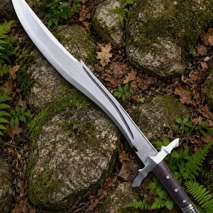 May include: A curved steel sword featuring a long, pointed blade with a central fuller and a dark, textured handle with metallic rivets and a pommel. The blade has a distinct sweeping edge and a sharp tip, while the hilt includes a crossguard.