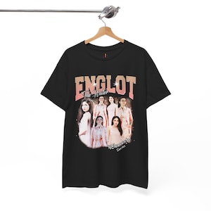May include: Black t-shirt with a retro-style graphic. The design features the word "ENGLOT" in a vintage font, with "The Water" beneath. Images of people are included. The text "4 Elements Series" is at the bottom of the design.