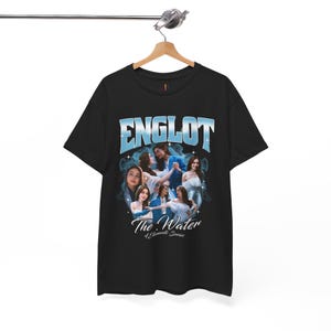 May include: Black t-shirt featuring the word "ENGLOT" in a light blue, stylized font. The shirt has an image of several women and the text "The Water 4 Elements Series" below the image.