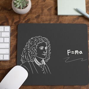 May include: Black mouse mat with a white illustration of Isaac Newton and the equation "F=ma" on a black background.