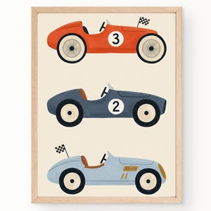 May include: A framed wall art print featuring three vintage-style race cars in orange, dark blue, and light blue. The orange car is marked with the number 3 and a checkered flag, the dark blue car with the number 2, and the light blue car has a flag.