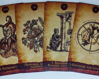 May include: Four tarot cards with illustrations and text. The cards feature images of a jester, plants, figures near a structure, and a person in a wheel. The cards have a vintage, aged appearance with text in a foreign language.