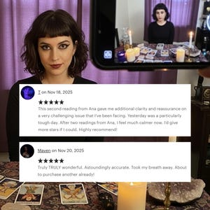 May include: A woman with dark hair and makeup is holding a phone displaying a tarot reading. The phone screen shows a table with tarot cards, candles, and a person. Text on the phone screen includes customer reviews.