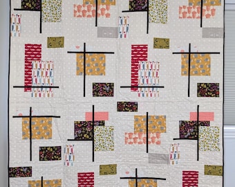 Bright, modern handmade patchwork quilt for animal lovers of all ages from Tallulah Quilts!