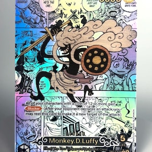 May include: A holographic trading card featuring a black silhouette of Monkey D. Luffy in a dynamic pose, overlaid on a manga panel background. The card displays text including 'Monkey D. Luffy', 'Blocker', and '5000' power, with a colourful, reflective finish.