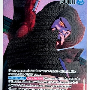 May include: A trading card featuring an illustration of Dracule Mihawk, a character from "The Seven Warlords of the Sea." The card has a purple and red background with text describing the character's abilities and a power level of 5000.